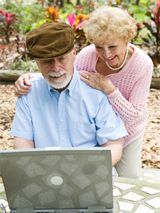 Older Couple Looking at a laptop